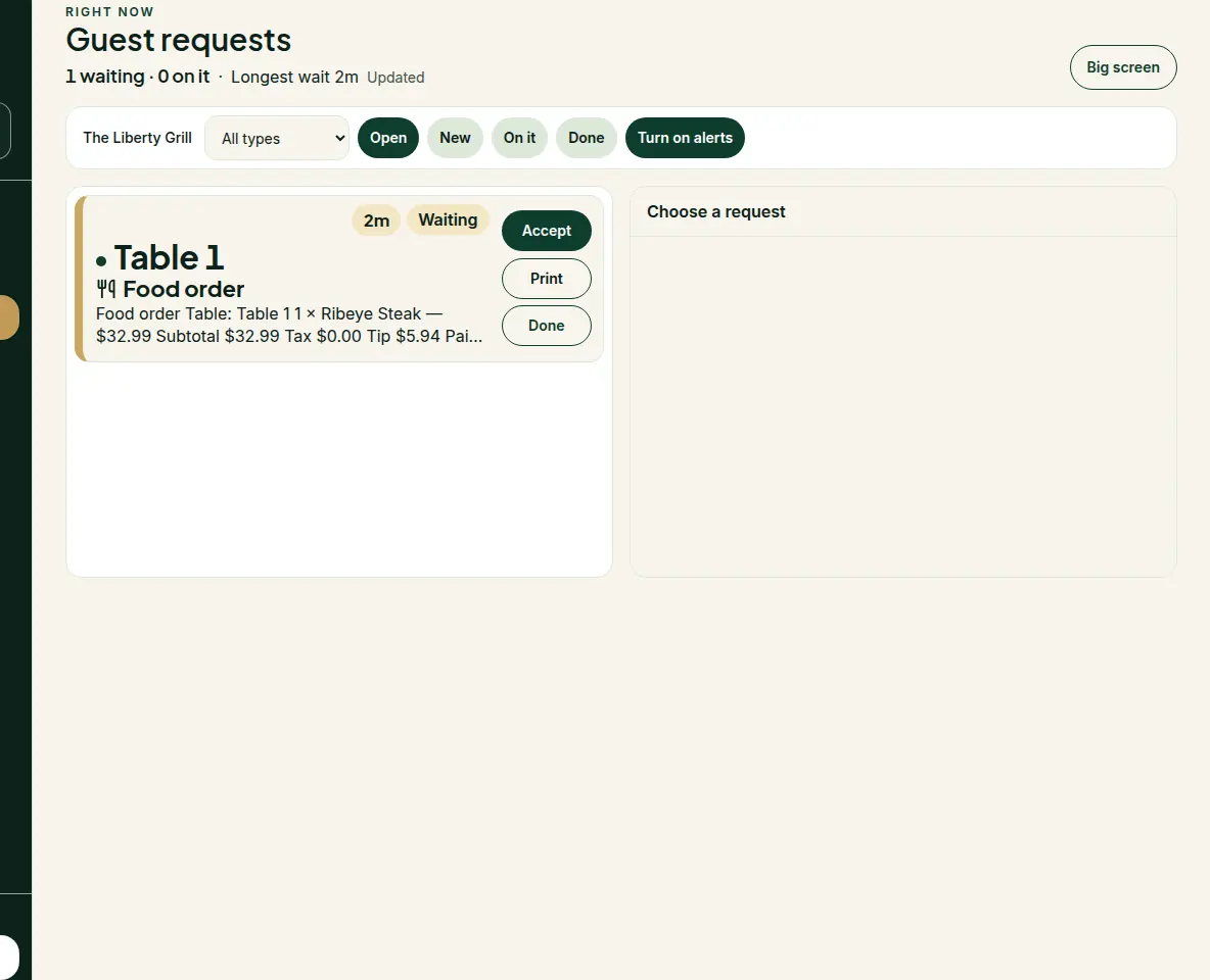 The Liberty Grill staff inbox with a paid food order for Table 1